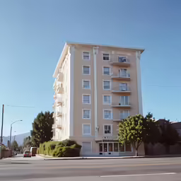 a multi - story building stands on an intersection