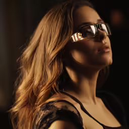 a woman with sun glasses looking to the right