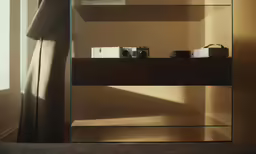 there are three items of glass on a table