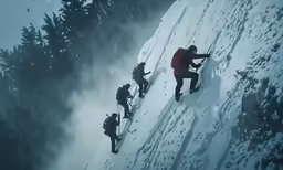 a man climbing up the side of a snowy mountain