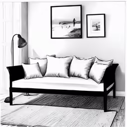 the black and white photo shows an old - fashioned couch with four pillows, along with other wall mounted pictures