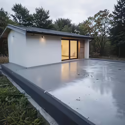 a house with a flat roof outside the front