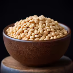 a brown bowl filled with white cereal