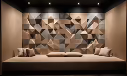the wall has several geometric shapes and is decorated with lighting