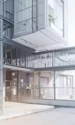 a futuristic building with glass walls and windows
