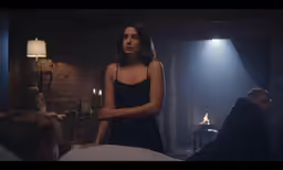 a woman is standing next to another man