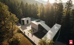 an aerial photo of the building in the woods