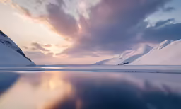 a picture of a mountain and a lake