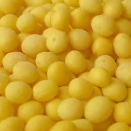 yellow peas are displayed in a bowl
