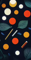 some orange and white leaves on a black surface