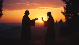 two people stand on a hill drinking wine