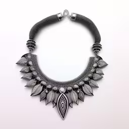 a very unique necklace with some little beads on it,an image of a necklace that looks like it is made of wire