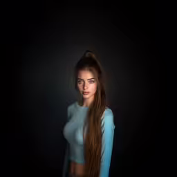 an image of a woman with long hair,a beautiful woman in blue is posing with long hair