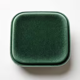 a square green object placed in a white background