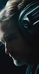 a man sitting down with headphones on