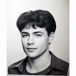 a black and white photo of a young man