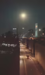 there are city lights shining over the street