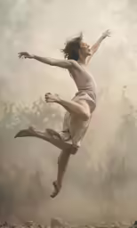 a person jumping in the air and holding a frisbee