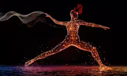 a woman is shown running with her hands in the air