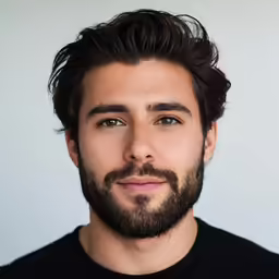 a close up photo of a man with a goatee