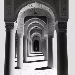 a long hallway lined with stone pillars
