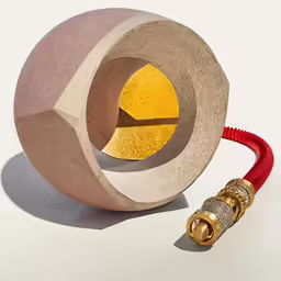a sculpture consisting of a stone with yellow circle at the top