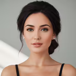 a woman wearing a black bra posing for a portrait