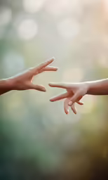 the people are reaching their hands toward each other