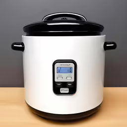 an electronic pressure cooker sitting on top of a table