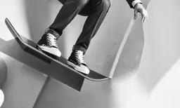 a person riding on top of a skateboard