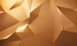a golden wall with geometric shapes that appear to have been painted gold