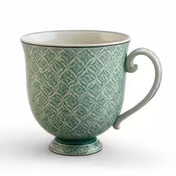 a tea cup on white background with a design in the middle