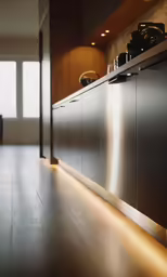a shiny stainless steel kitchen with wood cabinets