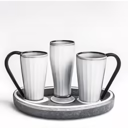three silver cups are sitting on a tray