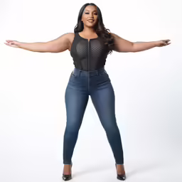 a black woman in high waist jeans and jacket
