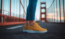 a woman standing near the golden gate bridge