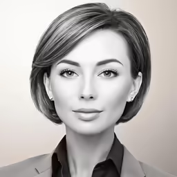 a woman wearing a suit and a black shirt