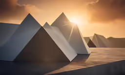 three concrete sculptures in front of the sun