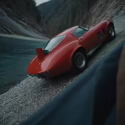 there is a vintage car sitting on the side of a road