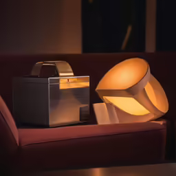 a lamp with an orange light and some other items