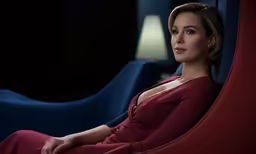 a woman is sitting in an office chair