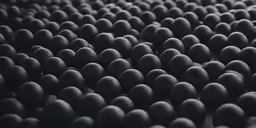 a bunch of small black balls are arranged in an arrangement