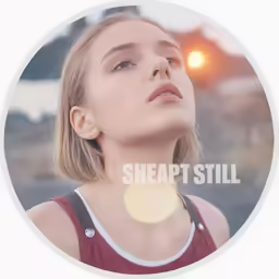 a girl wearing a red shirt stares upward in front of the camera