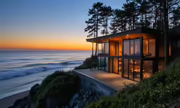 the house at the beach has some windows and is lit up