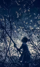 a young child standing in the middle of branches