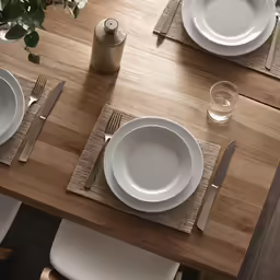 a table with place settings is set for dinner
