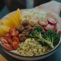 a plate of meat and vegetables are on the table