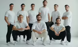a group of men are posing for a photo