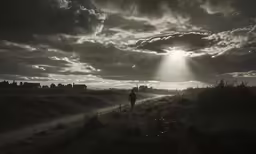 silhouette of a person walking on the trail under a cloudy sky