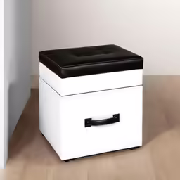 a white storage box with black lid sitting on the floor